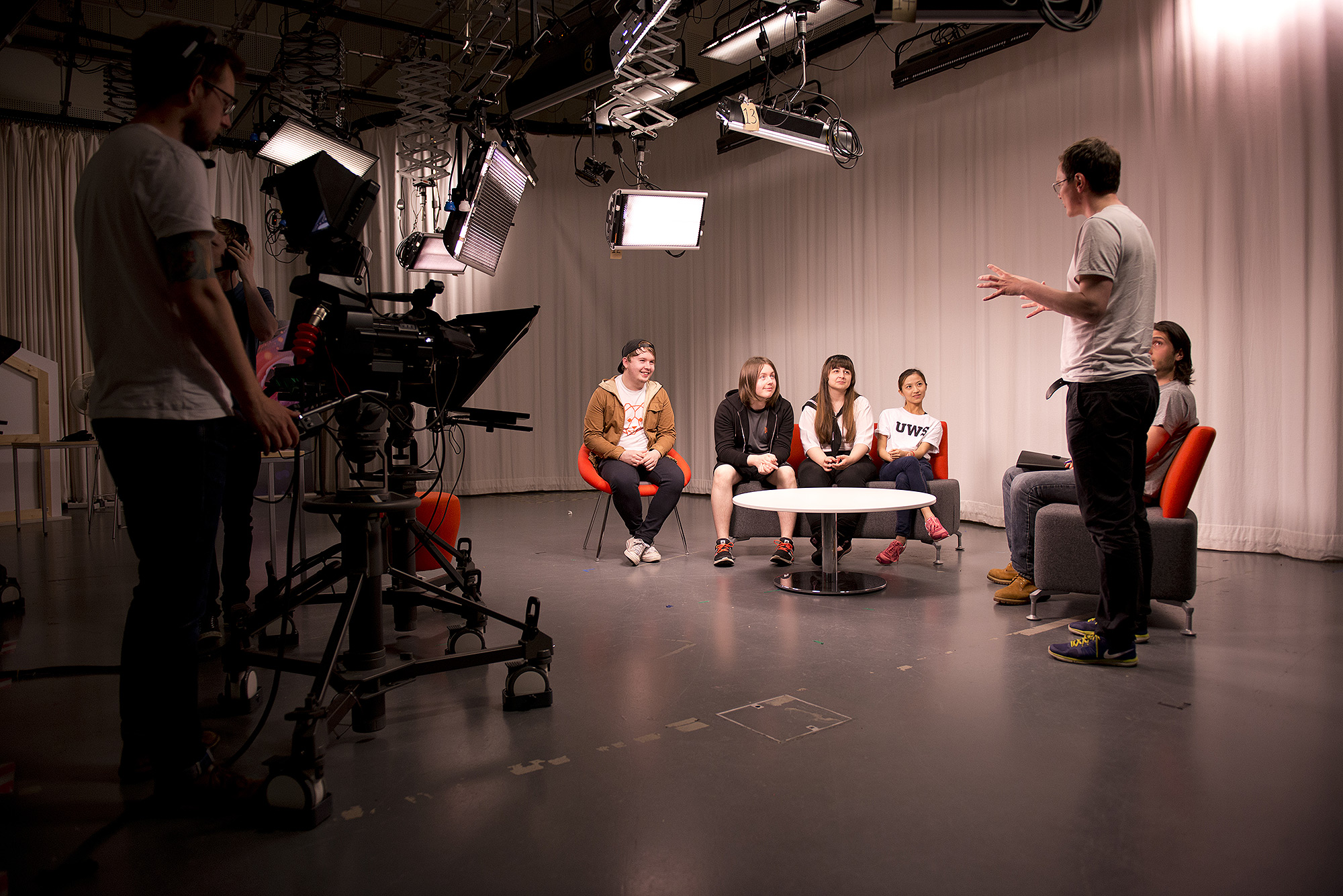 Student filming in TV studio 