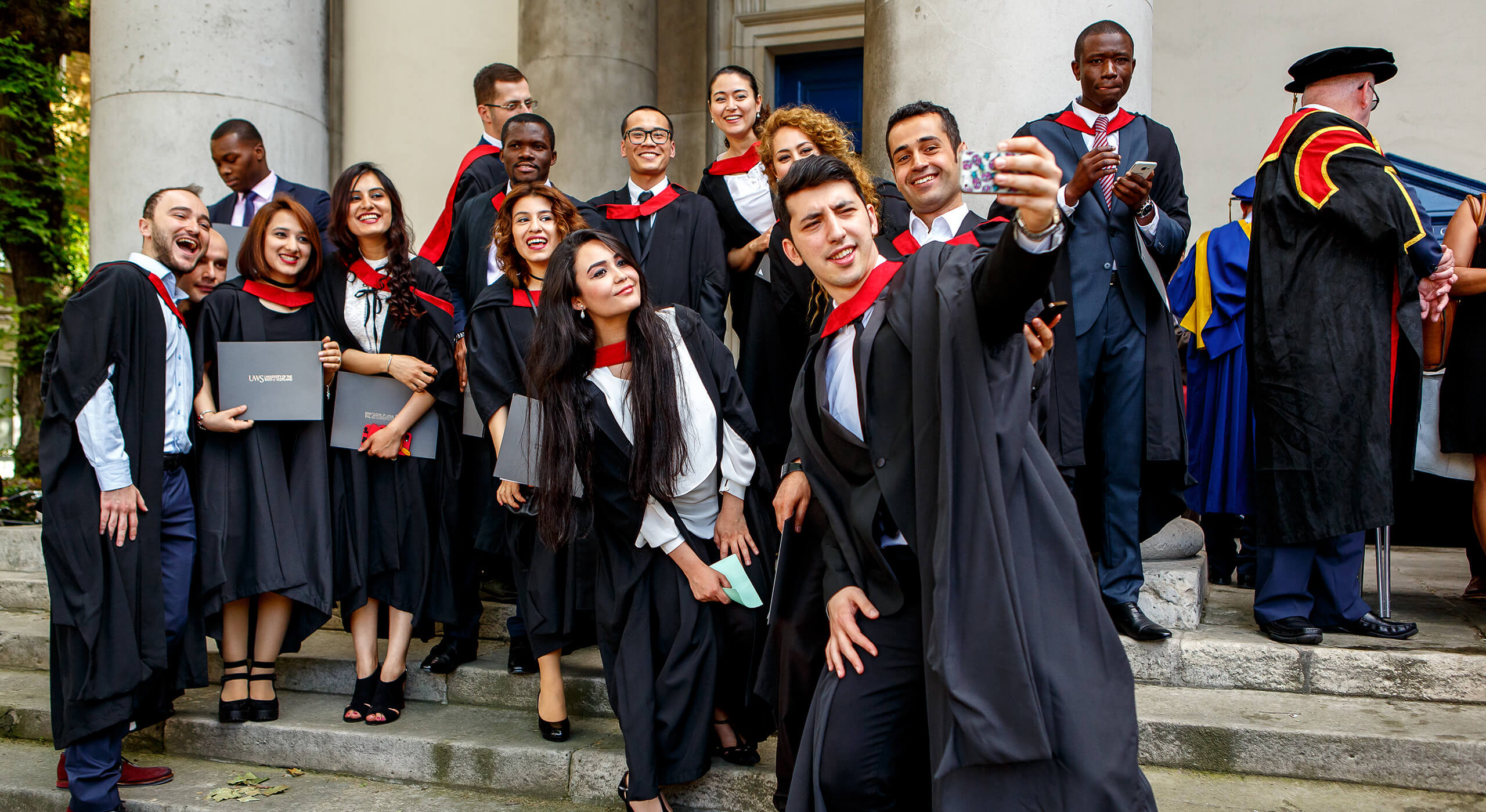 Happy students graduating from UWS London campus