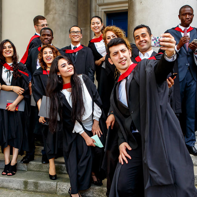 Happy students graduating from UWS London campus