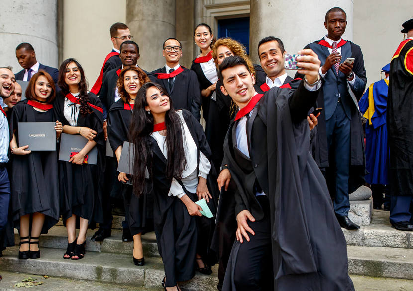 Happy students graduating from UWS London campus