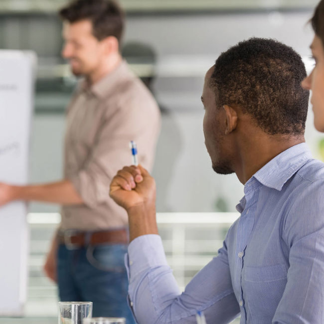 LEadership for Learning | Male in front of flipchart addressing others