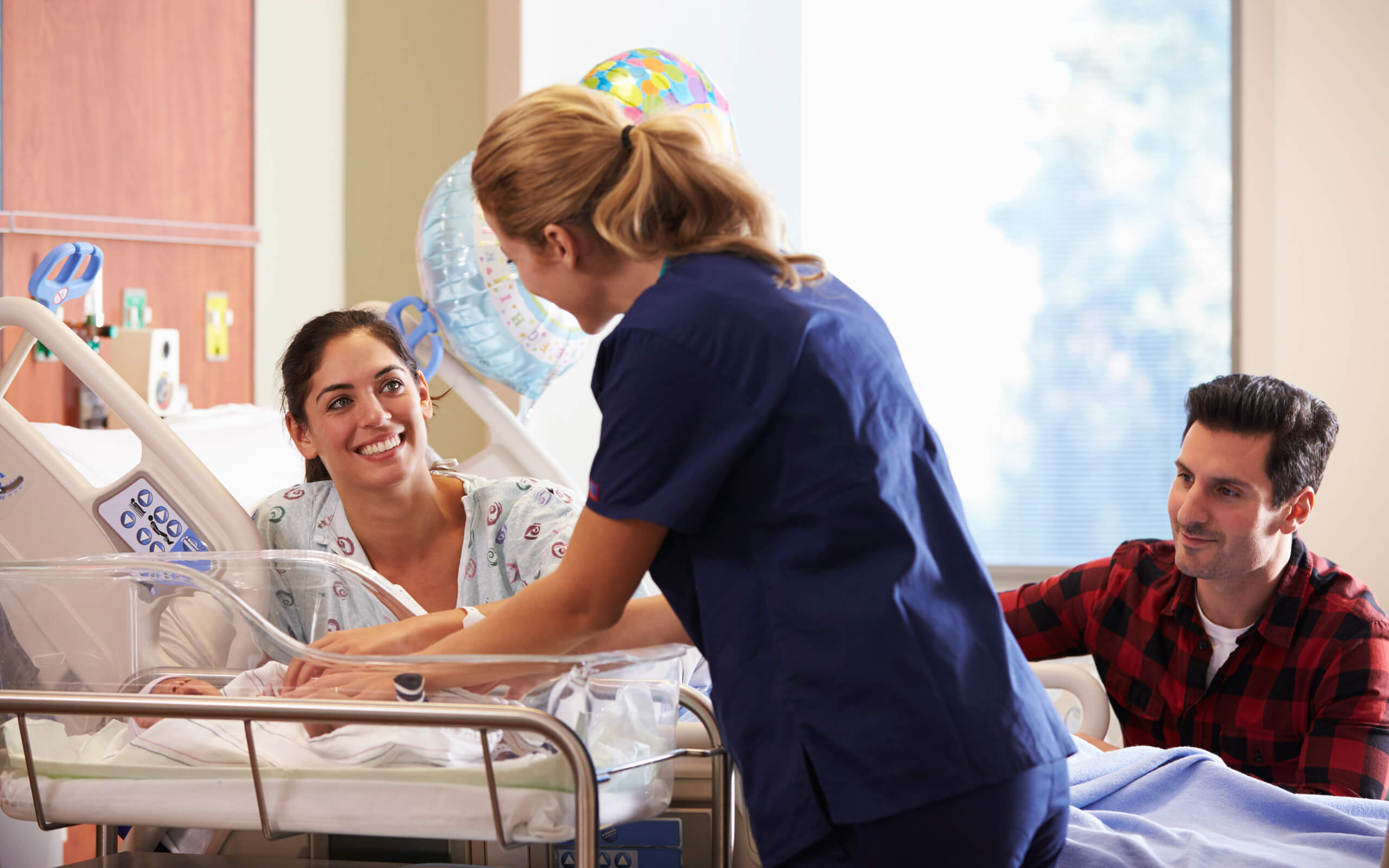 Maternity Care Assistant | Maternity Care Assistant speaking to Mum and baby