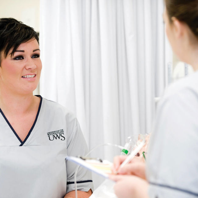Unscheduled Care | Female Nurse speaking to patient