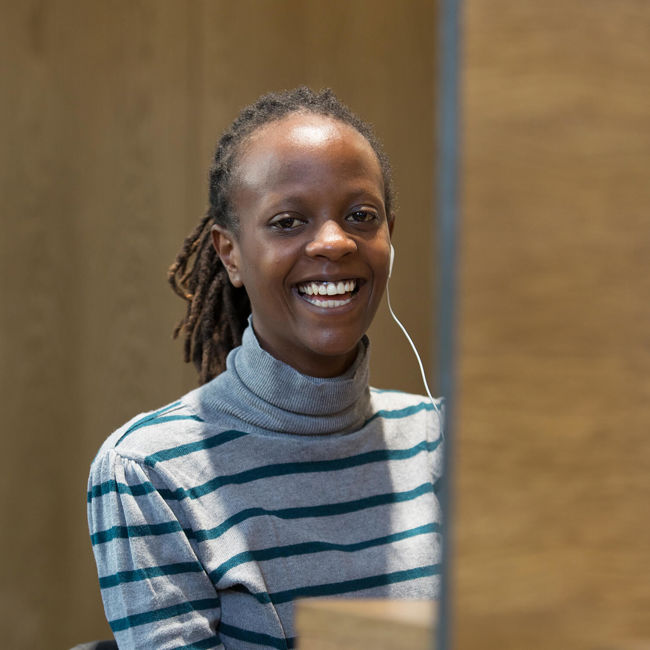Smiling female wearing stripy top