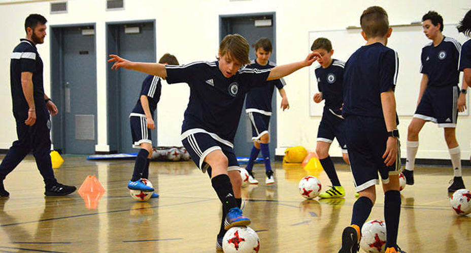 Pupils playing football