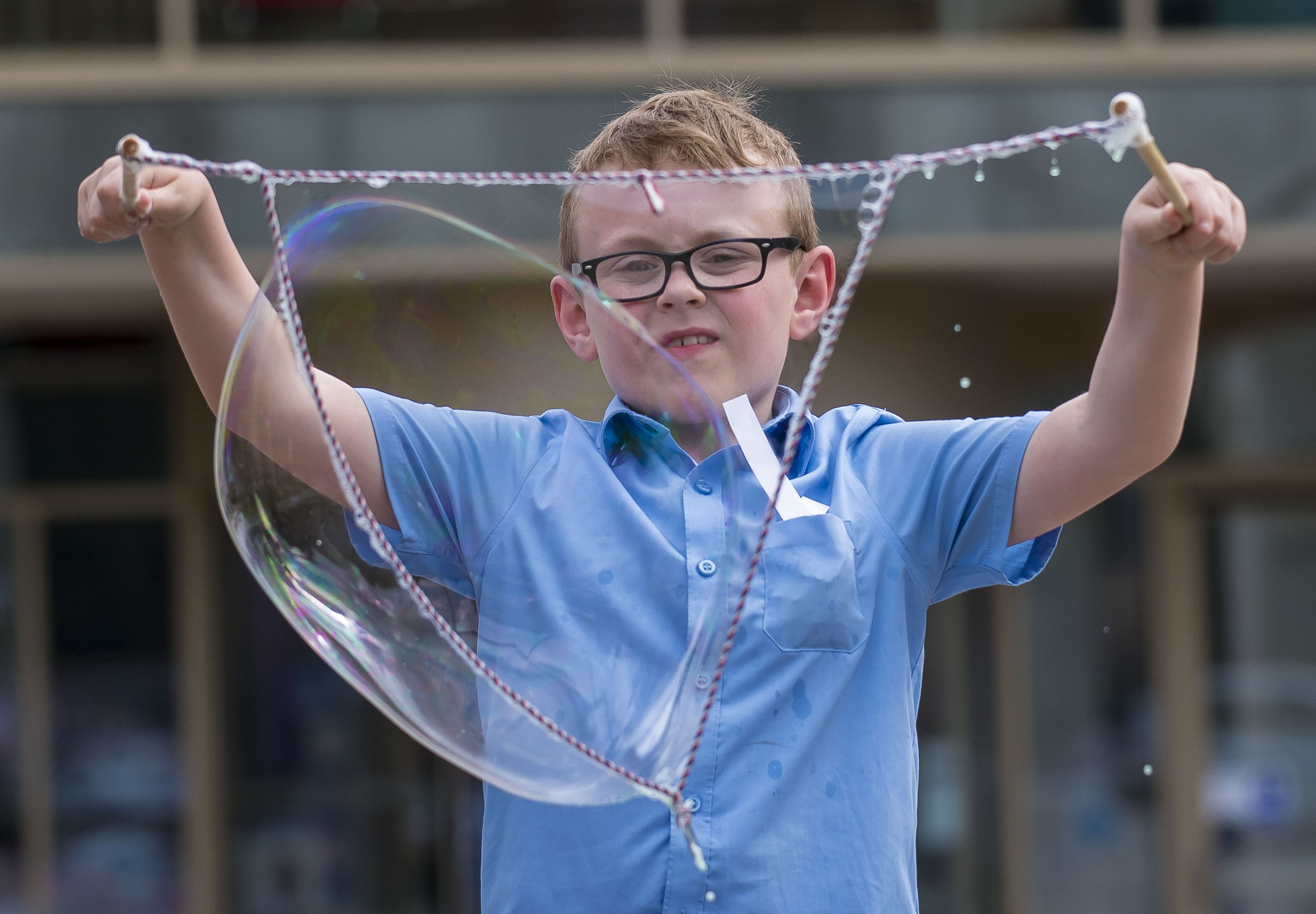 School pupil making bubbles 