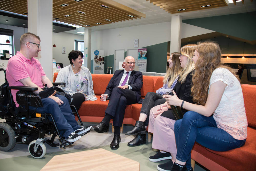 Deputy First Minister meeting UWS student on visit to Paisley Campus
