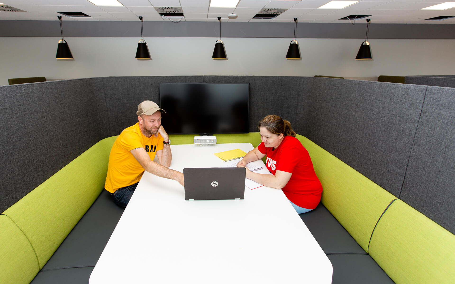 Two students working at a study space in Lanarkshire Campus 