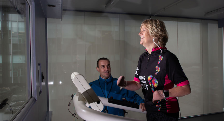 Corinne Hutton on treadmill with UWS staff Lanarkshire campus