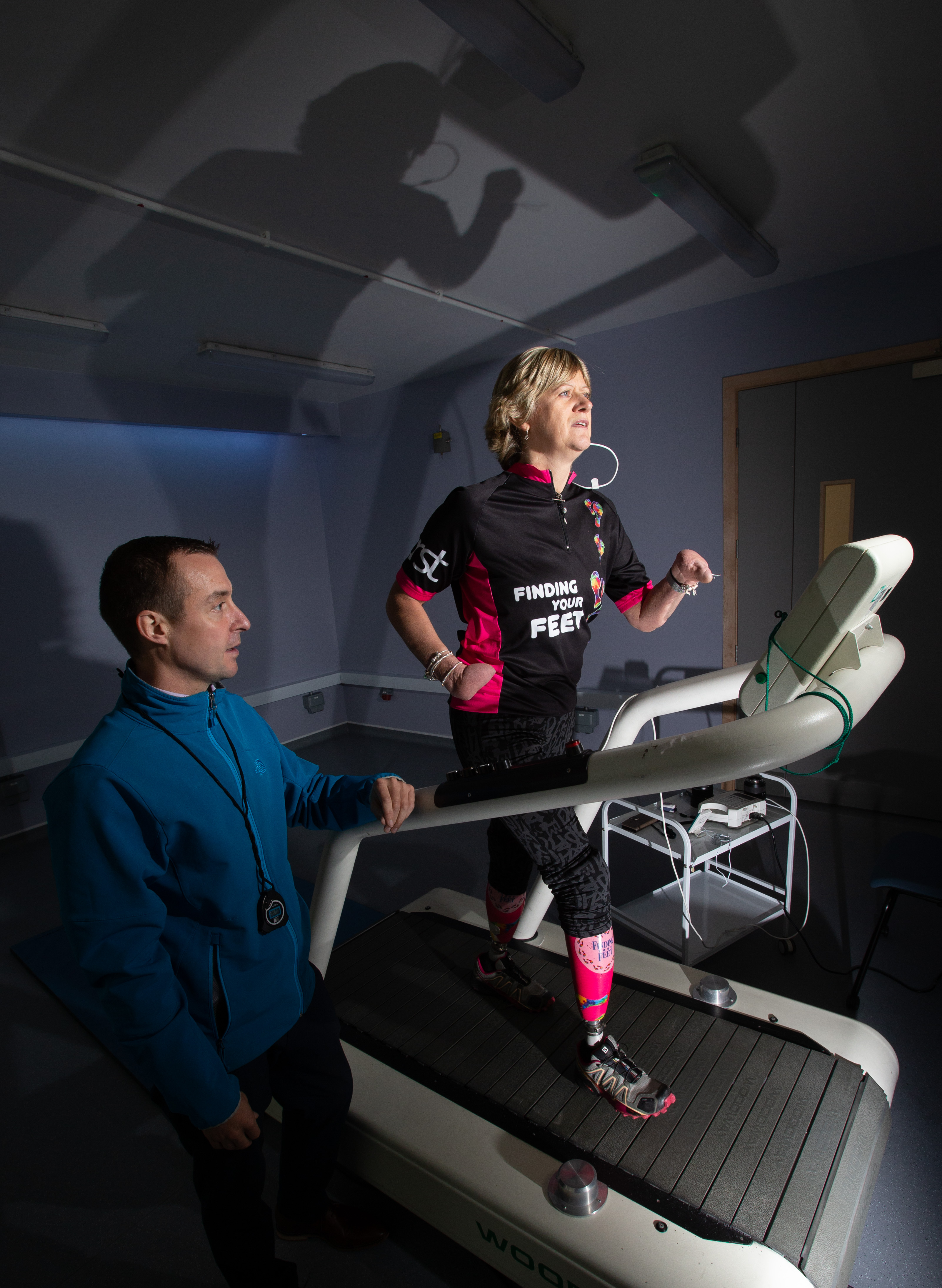 Corinne Hutton on treadmill with UWS staff Lanarkshire campus