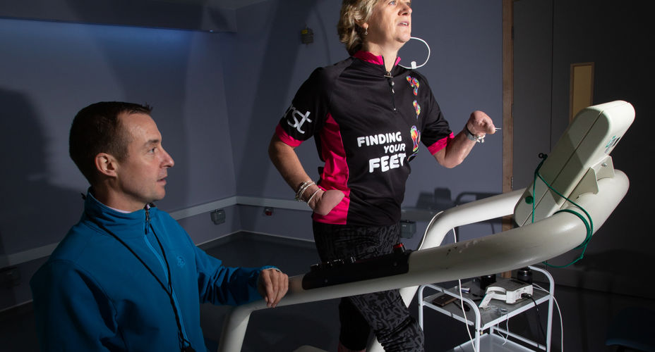 Corinne Hutton on treadmill with UWS staff Lanarkshire campus