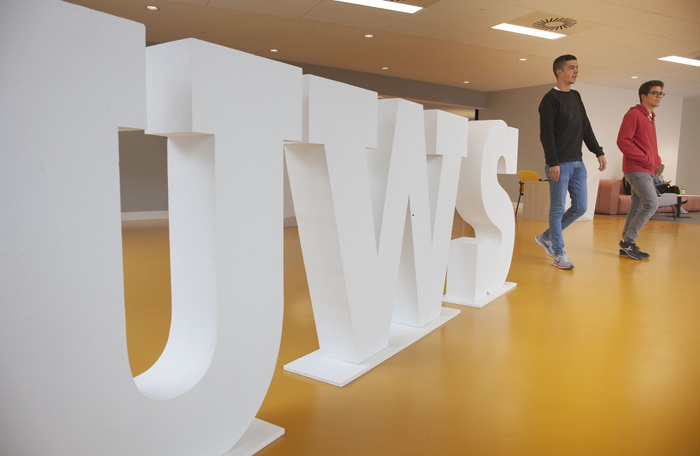 Students beside UWS Letters Lanarkshire campus