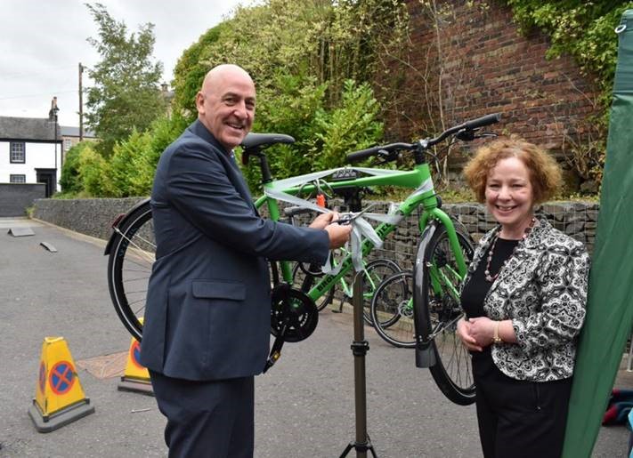 Prof. Mahoney and Maeve Cowper launching Brodies Bike with a bike 
