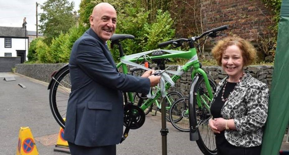 Prof. Mahoney and Maeve Cowper launching Brodies Bike with a bike