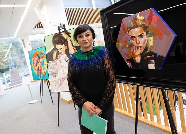 Artist Dominika with some of her artwork