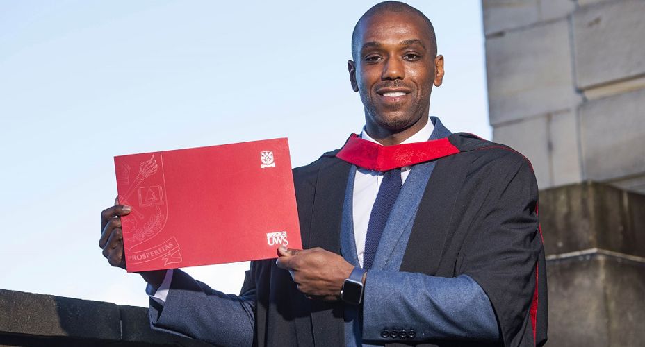 Junior Mendes with graduation certificate