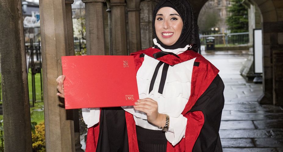 Linda Merzougui with graduation certificate