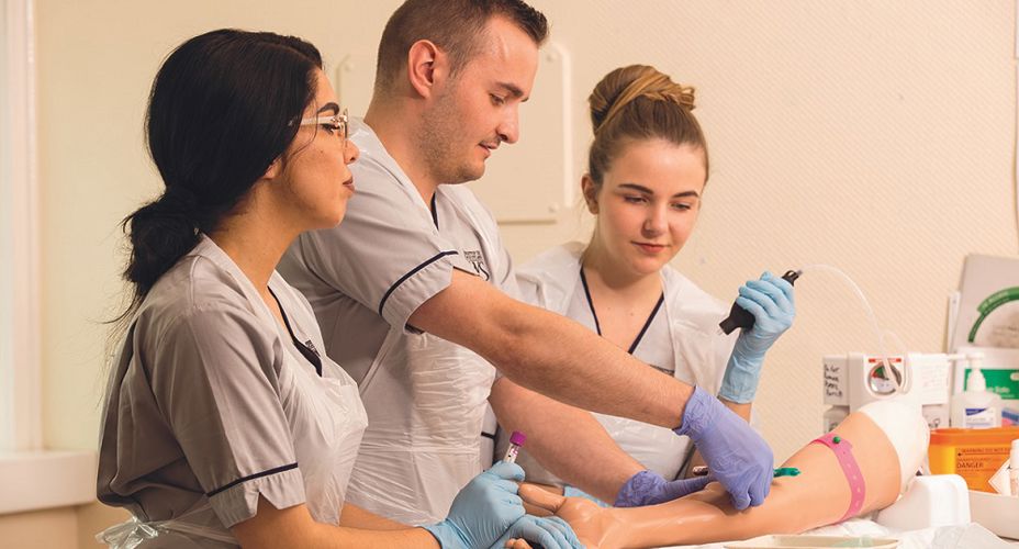 Peter Cartwright and student nurses in skills lab