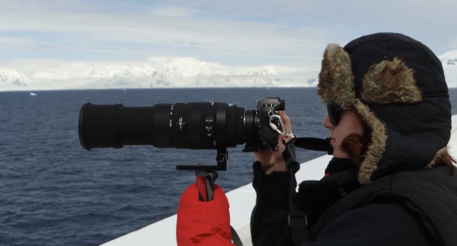 Student taking photos of the sea