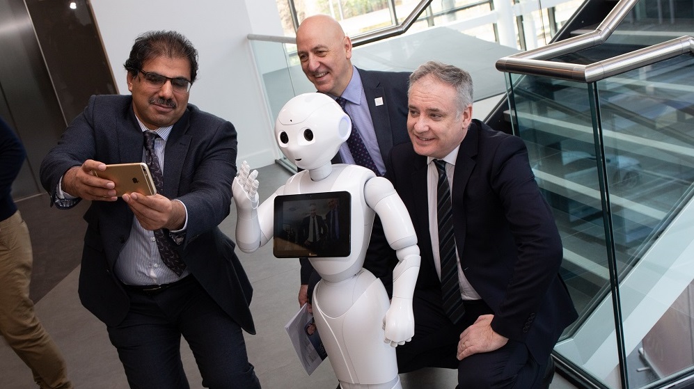 Prof Mahoney, Richard Lochhead and UWS staff with Robot