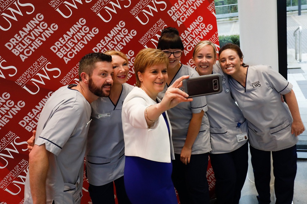First Minister with Nursing students taking selfie