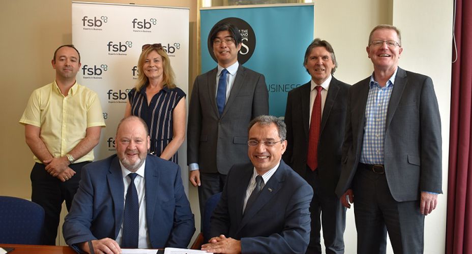 Federation of Small Business staff and UWS staff signing Memorandum of Understanding
