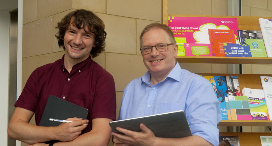George Burton and Barrie Wilson | two males holding book
