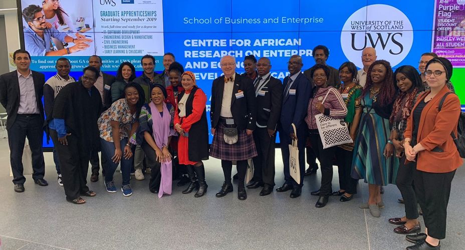 CAREED Group of delegates in front of screen Main reception Paisley campus