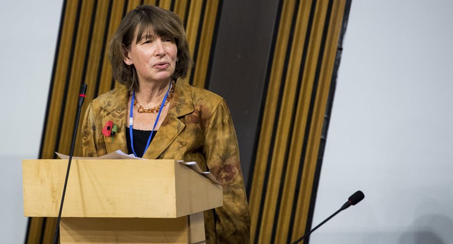Barbara Winton standing at podium