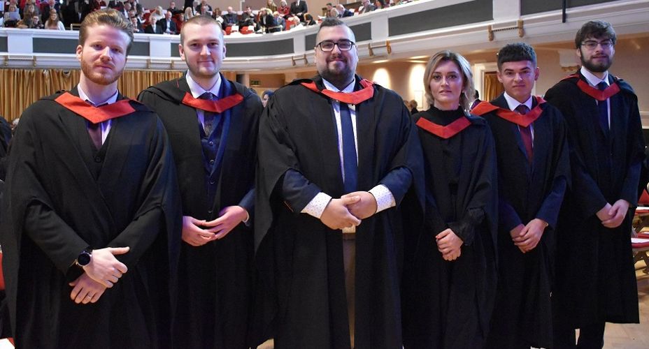 Group of students at Graduation wearing graduation gowns