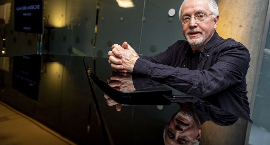 Patrick Doyle sitting at Piano