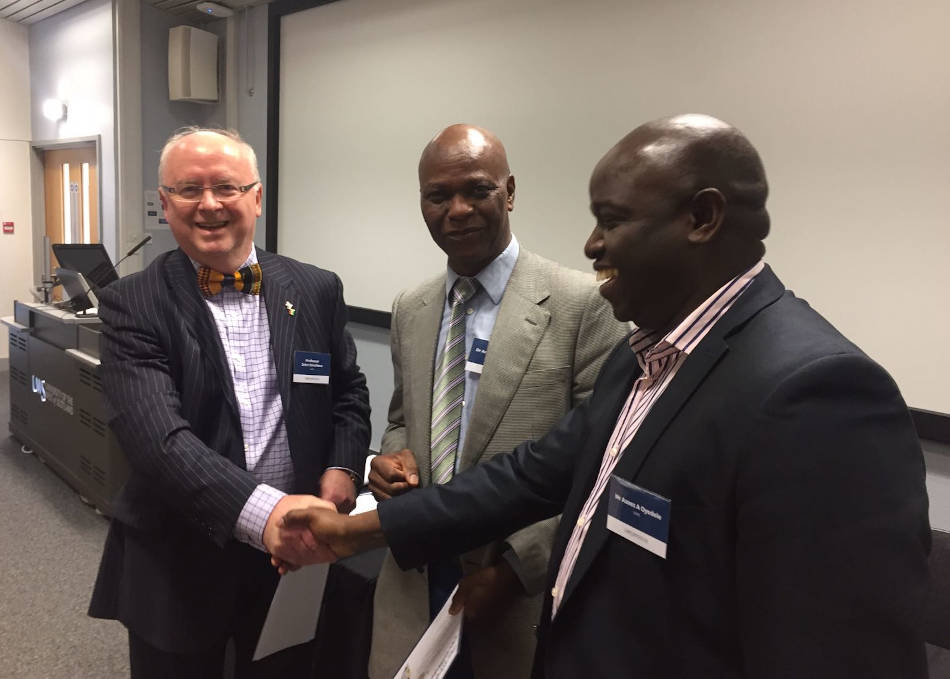 Careed conference prizegiving event showing CAREED Prof. John Struthers (Director), Dr Adebisi Adewole (Deputy Director) and conference participant.