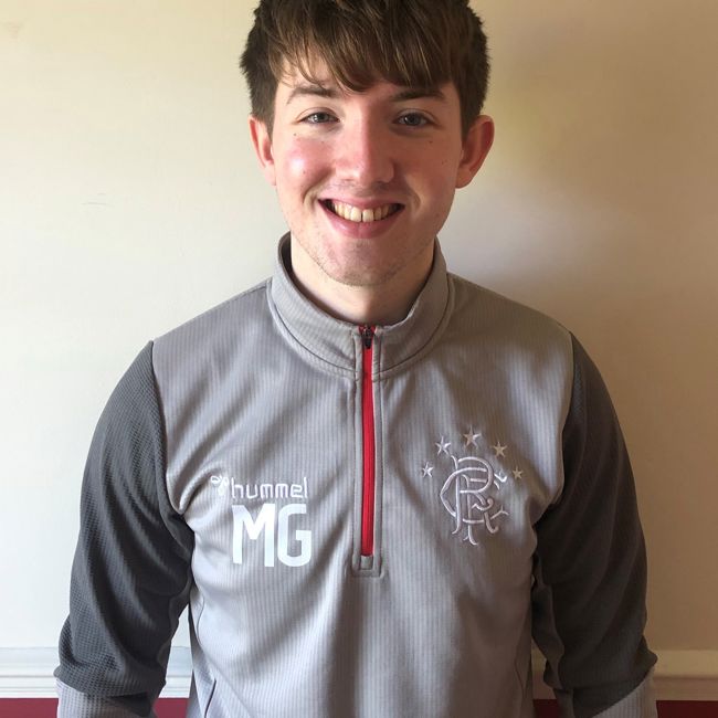 Michael Gallacher - Smiling Male wearing tracksuit