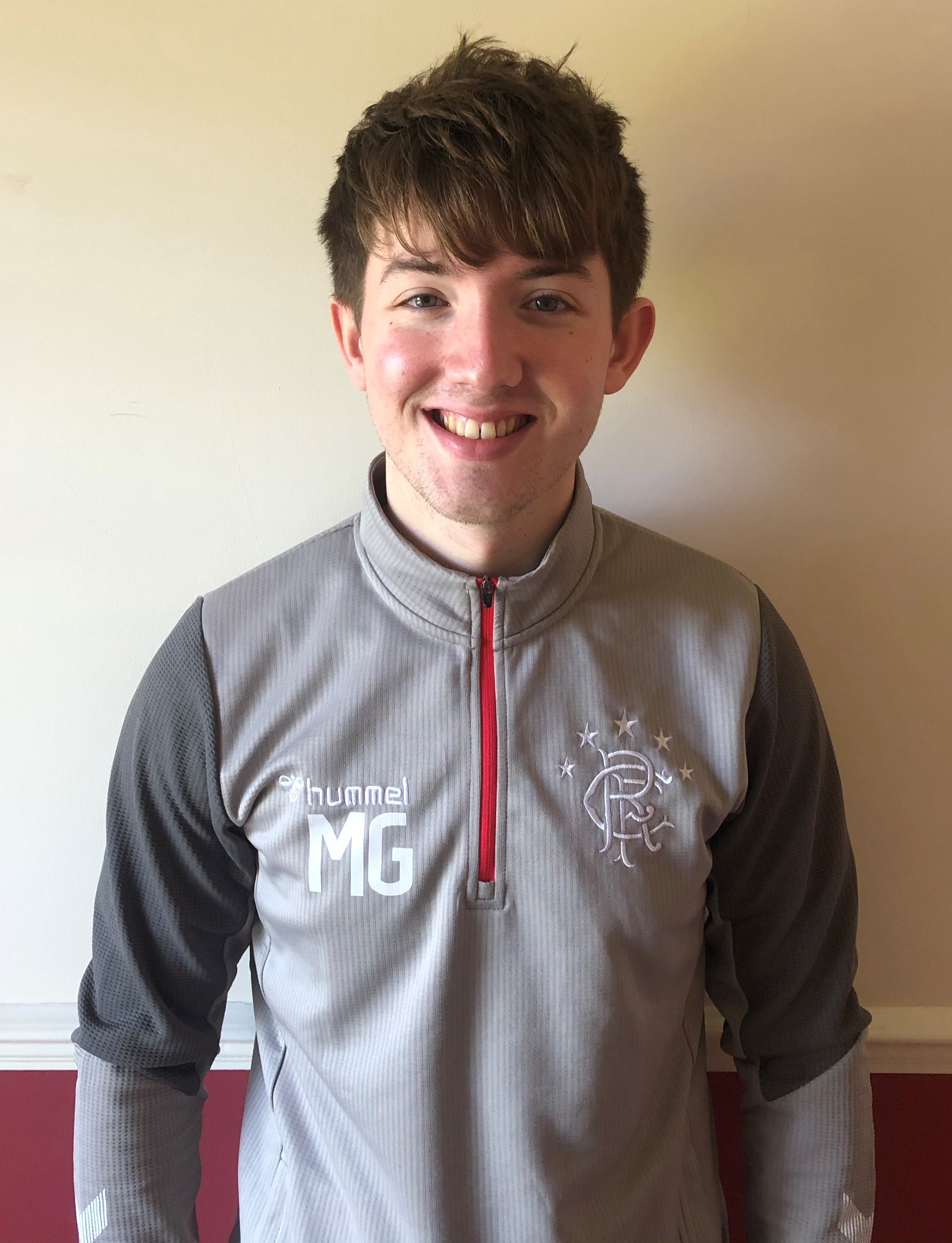 Michael Gallacher - Smiling Male wearing tracksuit
