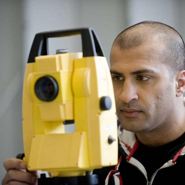 Male using Camera Equipment