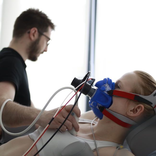 Male testing student who is wearing breathing equipment