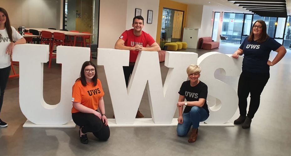 Student Recruitment Team in front of UWS letters