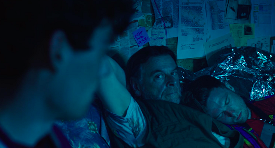 People in darkened room