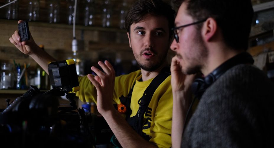 Two students using cameras