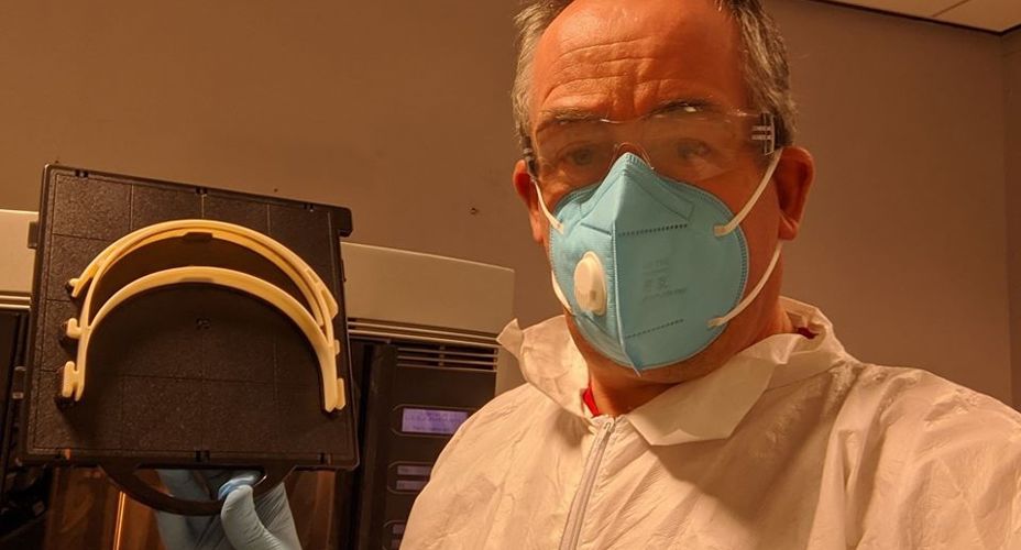 Scientist in PPE with 3D printing
